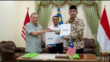 Penandatangan kerjasama perdagangan antar Indonesia dengan Malaysia yang disaksikan Menteri Pertanian Andi Amran Sulaiman (Ig a.amran_sulaiman/AI)
